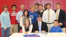 Friends and family join Andrew Friedholm at his signing with UNC Asheville.
 