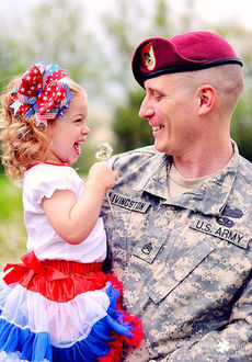 SSG Jason Livingston has a loving armful of Chamberlain, an extremely happy daughter.
 
 