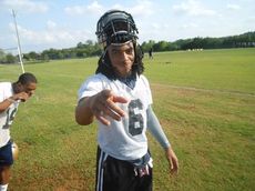 Emmanuel Kelly has a little fun during a water break during spring conditioning practices. He is expected to get some repetitions at quarterback during spring practice. Head Coach Wlll Young is looking for a replacement for graduated Reese Hannon.