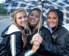Greer cheerleaders put a happy face on for a rainy Friday night in Travelers Rest.
 
