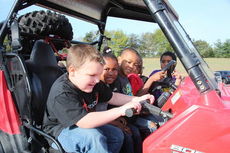 The kindergartners had the chance to climb in and out ATV's and four wheelers.