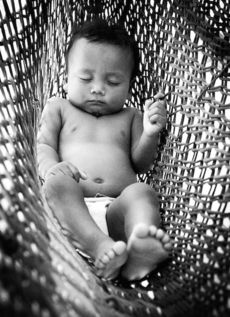 Williams titled this photo of an infant in a hammock 