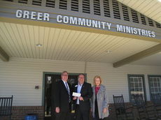  
 
Presenting the check to Stephen Smith, center, executive director, was Bob Morris, foundation president, and Sue Priester, board chair. 
 
 