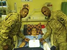 Army Spc. Brett Claycamp was awarded the Purple Heart while recovering from severe wounds from a rocket attack. 