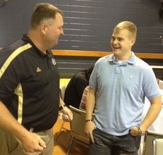 Greer Head Coach Will Young and Brett Claycamp connected at the Touchdown Club Friday at Greer Baptist Church. Claycamp, a Purple Heart recepient, was given a sustained standing ovation.