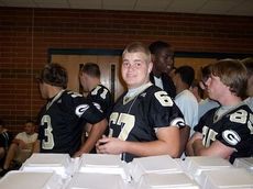 Brett Claycamp and Greer players were fed their pre-game meals at the school, a routine that continues.