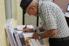 Bruce Taylor checks in for his Meals on Wheels route. Greer Community Ministries is in need of 21 drivers to help fill summer vacancies due to vacations and organizations taking time off.
 