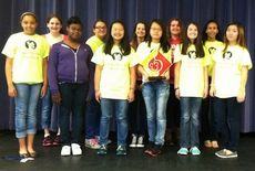 Chorus participants in Festival Disney, first row, left to right: Chelsi Bailey, Aniya Porcher, Tabitha Chen, Ester Kang (holding award), Katrina Wolhgemuth, and Lucy Wang. Second row, left to right: Alexandrea Battista, Vanessa Halbig, McKenna Hunter, Abigail Sloan, Megan Rudley. Not pictured, Maddie Leigh-Browne and Emme Bagwell.