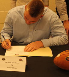 Cole Henderson signs to accept a letter-of-intent to play football at Lenoir-Rhyne University.
 