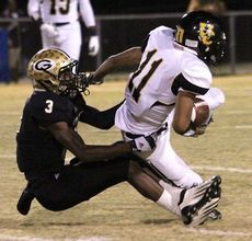 D'Anta Fleming drags down Union County's Chris Booker on this pass play.