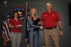 Greer Police Chief Reynolds presents Dakota Fitzgerald a certificate for completing the weeklong inaugural CSI: Day Camp presented by the Greer Police Department. Angie Childers, Vice President of the Greer Police Alumni, was the camp's instructor.