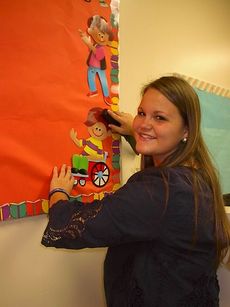 First year teacher, Rebecca Williams begins the school year preparing her Washington Center classroom. 
