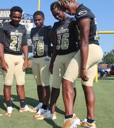 Gold football shoes will be worn by some Greer High School football players.
 
 