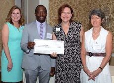 Caroline Robertson, Executive Director of Greer Relief, second from right, is presented a grant from members of the Spartanburg Regional Foundation and its Health Challenged Homelessness Prevention Program.
 
 
 