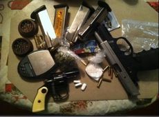 Guns, ammo and drugs are displayed after Greer Police confiscated these items after making arrests.