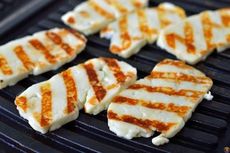 Grilled halloumi cheese, when seared on each side, adds extra flavor to that cheese and fruit tray when entertaining.
 