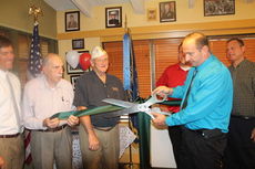 Greg Beehner does the honors of the ribbon cutting for the celebration of additional branding of Ryan's in Greer, which includes a game room for guests and a military Room of Honor for veterans and active military personnel and their families.
 