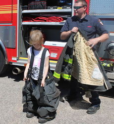 This young firefighter may have trouble running.
 
