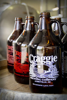 Growlers wait to be filled with the craft beer brewed at Craggie.
