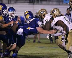 Greer and Travelers Rest linemen battle it out in the trenches in Friday's game won by Greer, 42-3.
