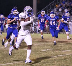 Jaylan Foster of Byrnes is en route to the end zone on one of his two punt returns for touchdowns in the first half.
 
 