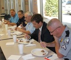 Judges graded the cookers on taste, smell, texture and other qualities. Left to right: Junior Holder (Quality Foods), Carl Howell (Deputy Fire Marshal), Bill Roughton (Greer Relief Business Director), Mark Owens (President/CEO Greer Chamber of Commerce) and Cpl. Bill Rhyne (South Carolina Highway Patrol).
 