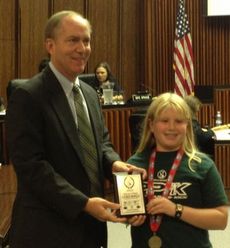 Greenville City Council presented a plaque to Lauren Morelli at a meeting to honor her PPK accomplishments and.