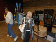 Before Lisa Suber could open the Stomping Grounds Coffee and Wine Bar in downtown Greer, there was much work to be done. Here she checks out details as work was progressing on the business.
