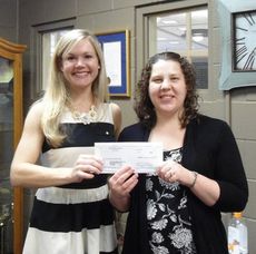 Jennifer Mathis, RMS Beta Club Sponsor, presents a $500 check to Brantley Reames, March of Dimes Community Development Director. 