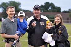 Greer High School Principal Marion Waters with his family at a football game at Dooley Field.
 