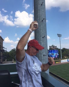 Mark Freeman holds the ball aloft as Greenville Drive fans cheered his catch of Isaias Lucena's second inning home run over the Green Monster.
 
 