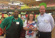 Julie Snyder is pictured with Bi-Lo associate Carlton Young of the Greer store, left, and store director Michael Knous.
 