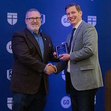 Provost and Dean of the University Faculty Dr. Nathan A. Finn (left) was named one of five evangelical scholars for 2018 by Southeastern Baptist Theological Seminary (SEBTS) at the annual Evangelical Society (ETS) meeting