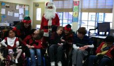 Washington Center students in Heather Petrusick’s class celebrate Santa’s arrival.