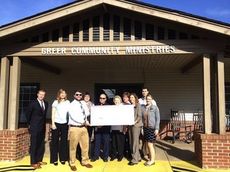 Members of Greer Leadership Class of XXXIV participated in the $1,000 check presentation to staff at Greer Community Ministries Wednesday morning.
 