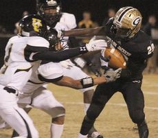 Quez Nesbitt (20) had 118 yards rushing on 24 attempts in tonight's second round state playoff game. It's the first game this season he did not score a touchdown.