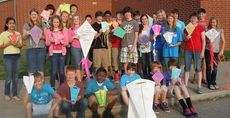 Riverside Middle School students pose with their kites.