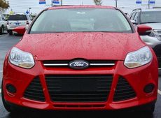 This red Ford Focus is shiny but wet today as it is part of the fleet of automobiles that are D&D's new showroom and service facility at 13655 E. Wade Hampton Blvd.
