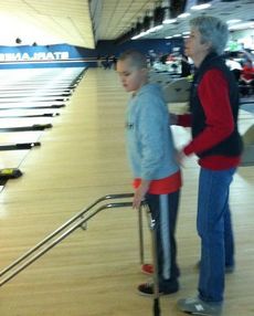 Washington Center student Zachary Satterfield practices bowling skills with his classroom Para-Professional Lucy Floyd during his class’ Community Based Instruction activity.