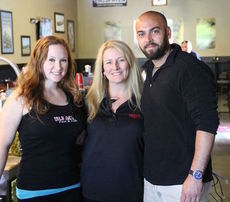 Becca Wactor, Denise VandenBerghe and Holden Graves at their new Wild Ace Pizza and Pub at 103 Depot Street.
 
