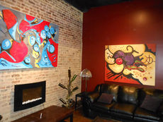 This area of the Stomping Grounds Coffee and Wine Bar features big local art and comfortable furniture with an electric fireplace. The two wine bottle trees add personality to the newest member of Greer’s “Restaurant Row”.