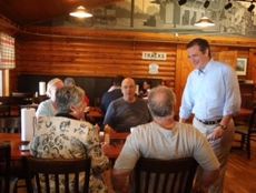 Sen. Ted Cruz, Republican presidential candidate, chats with diners at Mutt's BBQ in Greer.
 