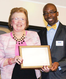 Betty Templeton receives SCPTA award from Clifford Fullmore, SCPTA president.