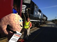 ‘I raced a train and all I got was this lousy full-body cast.' Norfolk Southern safety campaign dramatizes dangers of disregarding crossing signals and trespassing on railroad tracks.
 
 