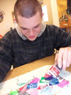 Washington Center student Blake King creates Holiday cards during Adaptive Art Class.