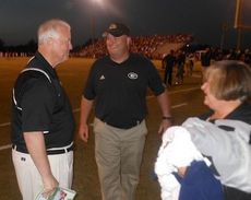 Greer Principal Marion Waters is greeted by Head Coach Will Young. Waters made his first appearance at a Greer football game since he had double bypass heart surgery on Oct. 5.