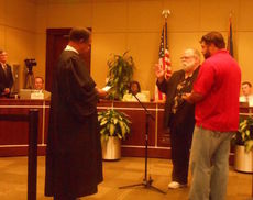 Wryley Bettis, District Five councilman, knows the routine of being sworn in after an unopposed race. Judge Hank Mims swears in Bettis for a four-term in 2012. He was unopposed.
 
 