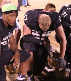Cole Henderson's (bowed head) season and career ended Friday night at Dooley Field.
 