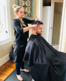 Vanessa Arrowood styles a customer's hair at the White House Salon in downtown Greer. Salons were allowed to open in South Carolina Monday for the first time in two months because of the coronavirus pandemic.
 
 