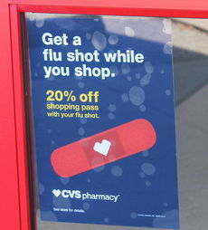 A CVS pharmacy advertises flu shots. The employees at this store have already received their flu vaccinations.
 
 
 